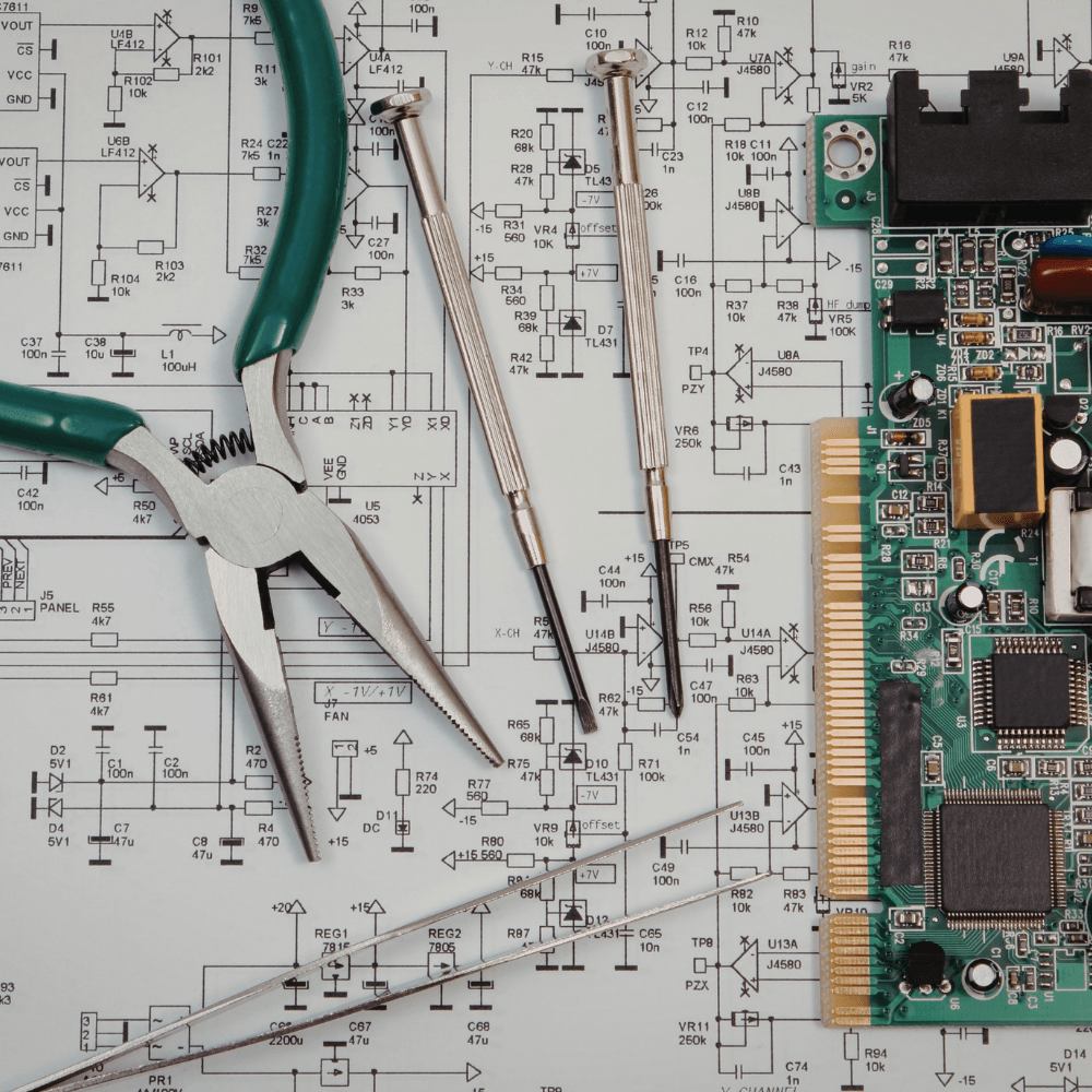 Photo showing tools over a blueprint.