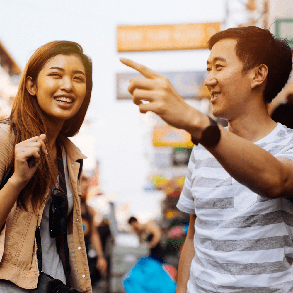 Photo of a person giving directions to another person.