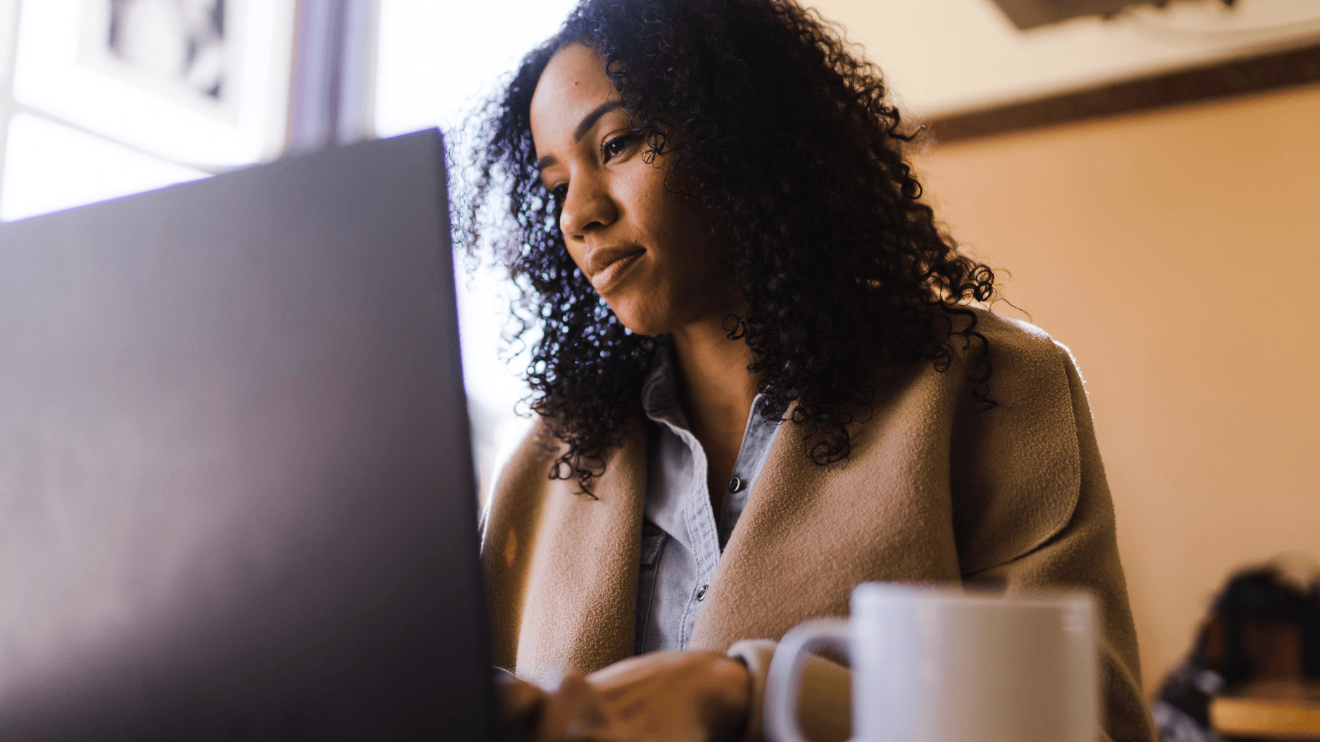 Photo of a person using their laptop.